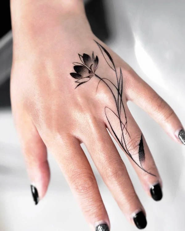 a hand with a tattoo on it